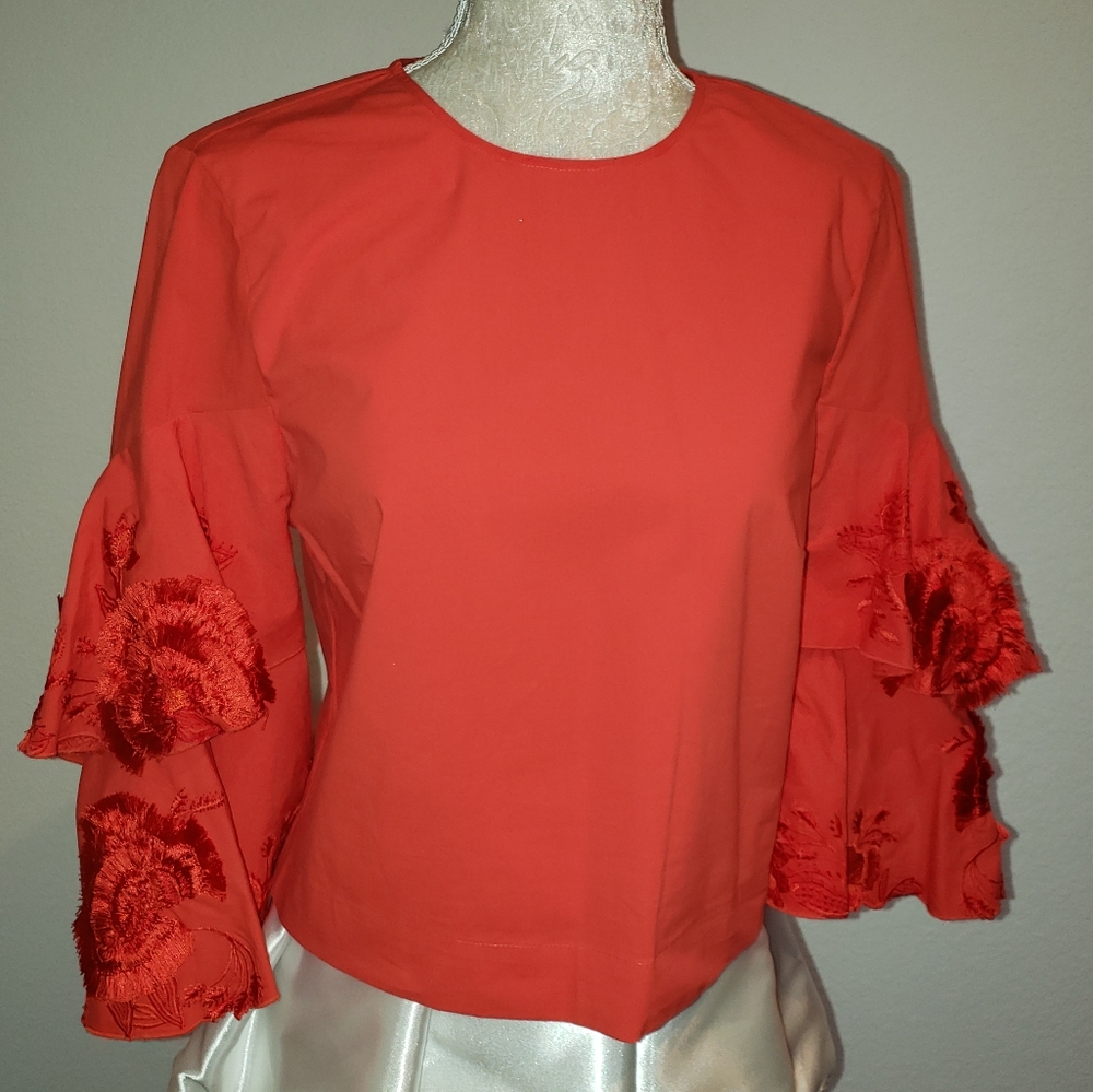 Red flamenco flare sleeves top by Rosie Natori